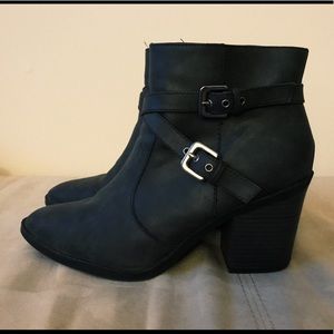 Gray heeled ankle boots.